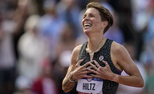 Nikki Hiltz celebrates after winning the women's 1500-meter final during the U.S. Track and Field Olympic Team Trials, Sunday, June 30, 2024, in Eugene, Ore. (AP Photo/Charlie Neibergall)