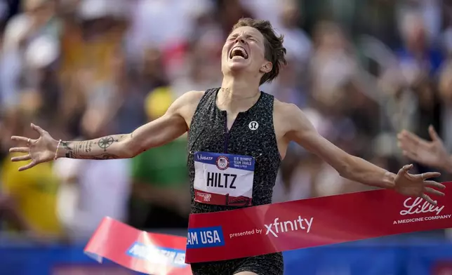 Nikki Hiltz celebrates after winning the women's 1500-meter final during the U.S. Track and Field Olympic Team Trials, Sunday, June 30, 2024, in Eugene, Ore. (AP Photo/Charlie Neibergall)