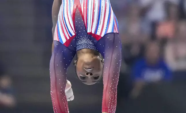 Simone Biles competes on the balance beam at the United States Gymnastics Olympic Trials on Sunday, June 30, 2024, in Minneapolis. (AP Photo/Charlie Riedel)