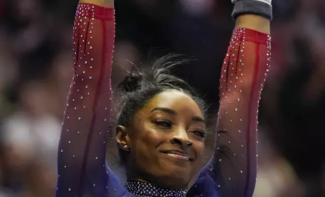Simone Biles competes on the uneven bars at the United States Gymnastics Olympic Trials on Sunday, June 30, 2024, in Minneapolis. (AP Photo/Abbie Parr)