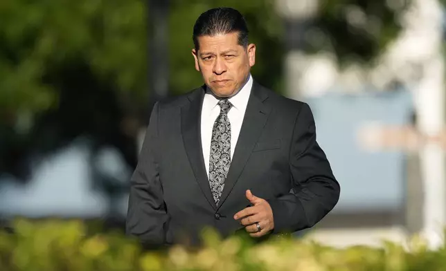 Former Uvalde Consolidated Independent School District police officer Adrian Gonzales arrives at the Uvalde County Courthouse, Thursday, July 25, 2024, in Uvalde, Texas. Gonzales made his first court appearance on charges of abandoning and failing to protect children. (AP Photo/Eric Gay)