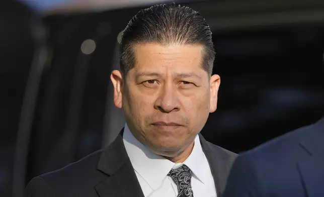 Former Uvalde Consolidated Independent School District police officer Adrian Gonzales arrives at the Uvalde County Courthouse, Thursday, July 25, 2024, in Uvalde, Texas. Gonzales made his first court appearance on charges of abandoning and failing to protect children. (AP Photo/Eric Gay)