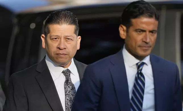 Former Uvalde Consolidated Independent School District police officer Adrian Gonzales, left, arrives at the Uvalde County Courthouse for a court appearance, Thursday, July 25, 2024, in Uvalde, Texas. (AP Photo/Eric Gay)