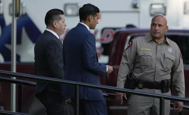 Former Uvalde Consolidated Independent School District police officer Adrian Gonzales, left, arrives at the Uvalde County Courthouse for a court appearance, Thursday, July 25, 2024, in Uvalde, Texas. (AP Photo/Eric Gay)