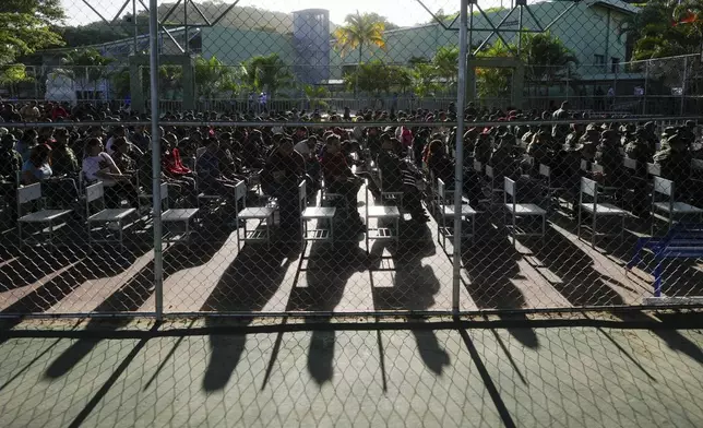 People wait for their turn to vote in the presidential elections at Fort Tiuna in Caracas, Venezuela, Sunday, July 28, 2024. (AP Photo/Fernando Vergara)