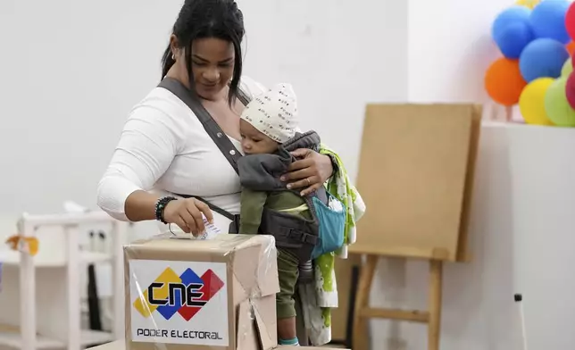 Alejandra Rivas votes during presidential elections in Caracas, Venezuela, Sunday, July 28, 2024. (AP Photo/Matias Delacroix)