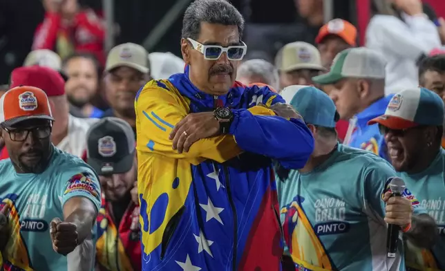 President Nicolas Maduro addresses supporters outside Miraflores presidential palace after electoral authorities declared him the winner of the presidential election in Caracas, Venezuela, Monday, July 29, 2024. (AP Photo/Fernando Vergara)