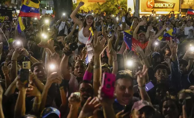 Supporters of the opposition's presidential candidate Edmundo Gonzalez cheer during his closing election campaign rally in Caracas, Venezuela, Thursday, July 25, 2024. The presidential election is set for July 28. (AP Photo/Matias Delacroix)