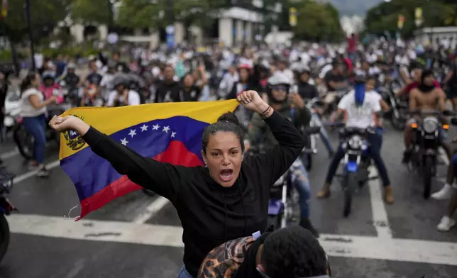 Protesters demonstrate against the official election results declaring President Nicolas Maduro's reelection, the day after the vote in Caracas, Venezuela, Monday, July 29, 2024. (AP Photo/Matias Delacroix)