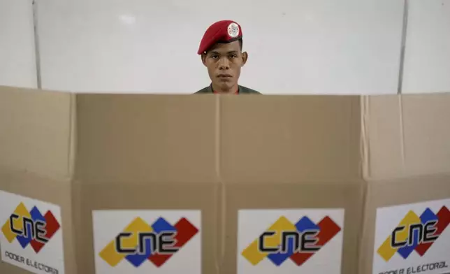 A member of the presidential guard votes during presidential elections in Caracas, Venezuela, Sunday, July 28, 2024. (AP Photo/Matias Delacroix)