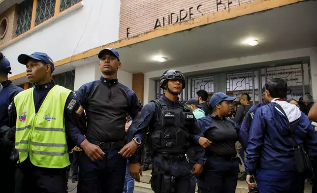 Police guard de Andres Bello School polling center during presidential elections in Caracas, Venezuela, Sunday, July 28, 2024. (AP Photo/Cristian Hernandez)