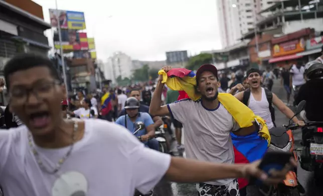 Protesters demonstrate against the official election results declaring President Nicolas Maduro the winner the day after the presidential election in Caracas, Venezuela, Monday, July 29, 2024. (AP Photo/Matias Delacroix)