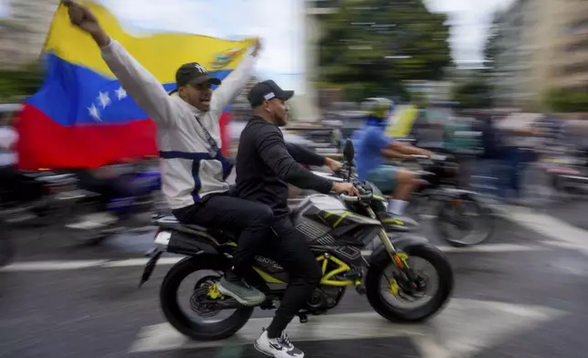 Protesters demonstrate against the official election results declaring President Nicolas Maduro's reelection, the day after the vote in Caracas, Venezuela, Monday, July 29, 2024. (AP Photo/Fernando Vergara)