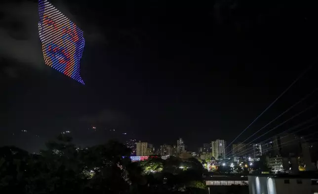 Drones depict the image of President Nicolas Maduro over Miraflores presidential palace after electoral authorities declared him the winner of the presidential election in Caracas, Venezuela, Monday, July 29, 2024. (AP Photo/Cristian Hernandez)