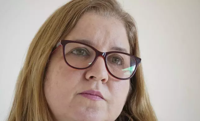 Venezuelan Liseth Díaz gives an interview at her work place in Santiago, Chile, Thursday, July 11, 2024. Díaz and her family, who ran a contractor company in Guacara, ended up closing it and in December 2017 she, her husband and three daughters crossed through Colombia, Ecuador and Peru, until they reached Santiago, where she now works in the fiber optic industry. (AP Photo/Matias Basualdo)