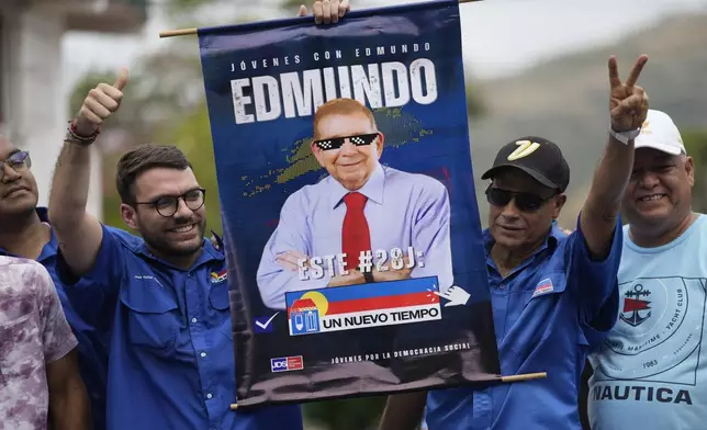 Supporters hold an electoral poster promoting opposition presidential candidate Edmundo González during the launch of his campaign for the upcoming election, in La Victoria, Venezuela, May 18, 2024. (AP Photo/Ariana Cubillos)