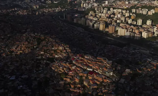 Homes cover a hill in the Petare neighborhood of Caracas, Venezuela, Thursday, July 25, 2024, days before the July 28 presidential election. (AP Photo/Matias Delacroix)