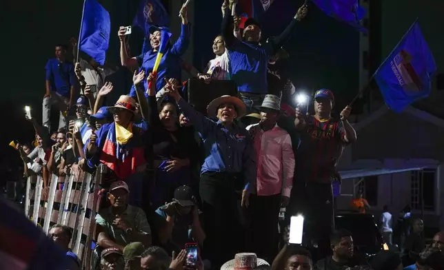 Opposition supporters cheer for presidential candidate Edmundo Gonzalez and opposition leader Maria Corina Machado during a campaign rally in Maracaibo, Venezuela, Tuesday, July 23, 2024. The presidential election is set for July 28. (AP Photo/Matias Delacroix)