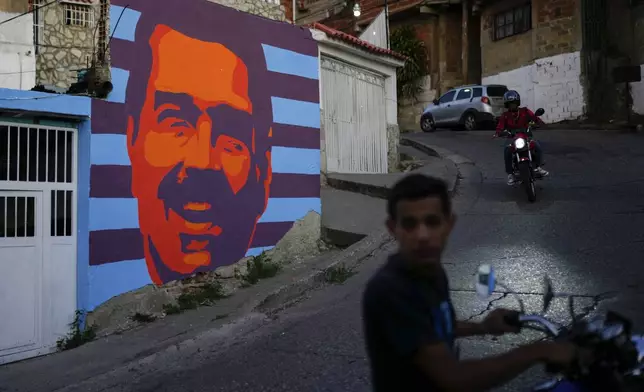 A campaign mural promoting Venezuelan President Nicolas Maduro on a wall in Caracas, Venezuela, Wednesday, July 17, 2024. Venezuela is set to hold presidential elections July 28. (AP Photo/Ariana Cubillos)