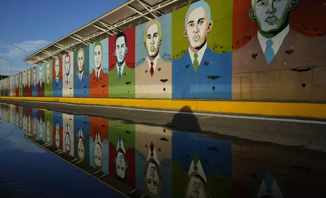 Murals of late President Hugo Chavez outside the Museum of the Llanos in Barinas, Venezuela, Sunday, July 7, 2024. Venezuela is set to hold a presidential election on July 28. (AP Photo/Ariana Cubillos)