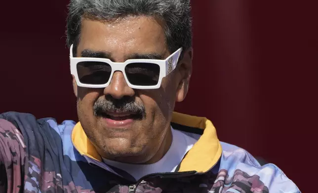 Venezuelan President Nicolas Maduro looks on during a campaign rally in the neighborhood of Petare in Caracas, Venezuela, Thursday, July 18, 2024. Venezuela is set to hold its presidential election on July 28. (AP Photo/Ariana Cubillos)