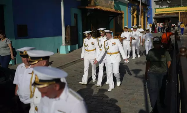 Russian crew members attend a welcoming tour by Venezuelan authorities in La Guaira, Venezuela, after the Almirante Gorshkov frigate and Akademik Pashin oil tanker of the Russian Navy docked there, Tuesday, July 2, 2024. (AP Photo/Ariana Cubillos)