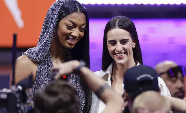 FILE - LSU's Angel Reese, left, and Iowa's Caitlin Clark, right, pose for a photo before the WNBA basketball draft, Monday, April 15, 2024, in New York. Caitlin Clark and Angel Reese will once again step into the spotlight during All-Star Weekend with their matchup against Team USA. (AP Photo/Adam Hunger, File)