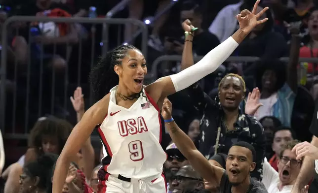 A'ja Wilson, of Team USA, celebrates after she made 3-point basket against Team WNBA during the second half of a WNBA All-Star basketball game Saturday, July 20, 2024, in Phoenix. (AP Photo/Ross D. Franklin)