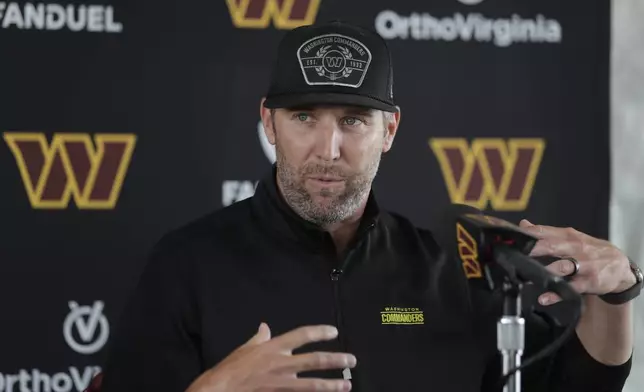 Washington Commanders new general manager Adam Peters gestures during an NFL football press conference in Ashburn, Va., Tuesday, July 23, 2024. (AP Photo/Luis M. Alvarez)