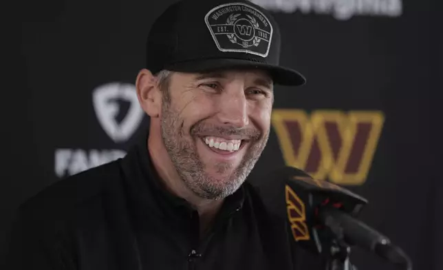 Washington Commanders new general manager Adam Peters smiles during an NFL football press conference in Ashburn, Va., Tuesday, July 23, 2024. (AP Photo/Luis M. Alvarez)