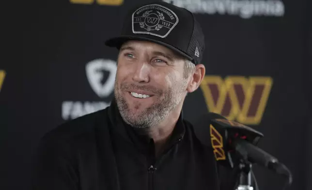 Washington Commanders new general manager Adam Peters smiles during an NFL football press conference in Ashburn, Va., Tuesday, July 23, 2024. (AP Photo/Luis M. Alvarez)