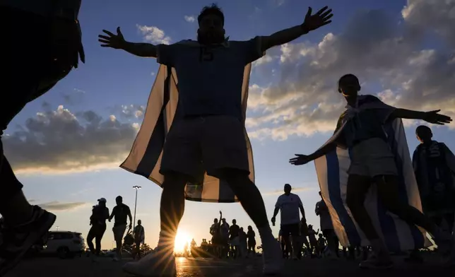 Fans of Uruguay arrive at the stadium before a Copa America Group C soccer match between Uruguay and Bolivia in East Rutherford, N.J., Thursday, June 27, 2024. (AP Photo/Julia Nikhinson)