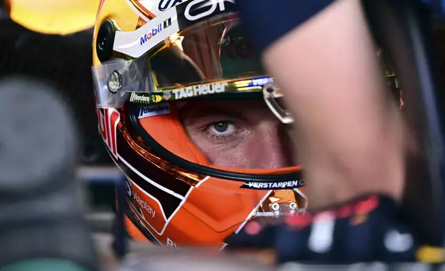Red Bull driver Max Verstappen, of the Netherlands, sits in his car during the qualifying session for the Austrian Formula One Grand Prix at the Red Bull Ring racetrack in Spielberg, Austria, Saturday, June 29, 2024. (AP Photo/Christian Bruna, Pool)