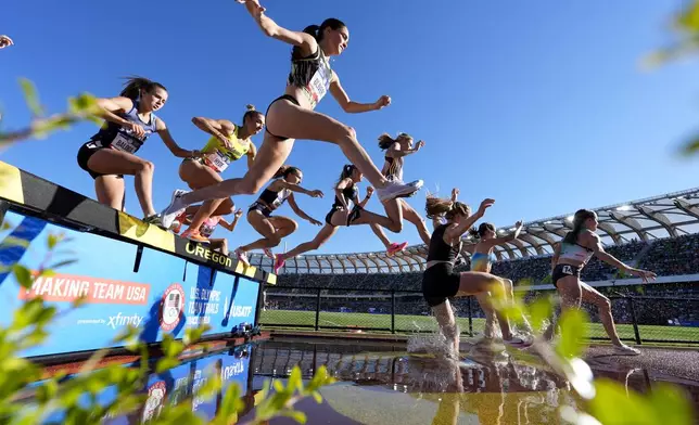 Runners compete in the women's 3000-meter steeplechase at the U.S. Track and Field Olympic Team Trials, Monday, June 24, 2024, in Eugene, Ore. (AP Photo/Charlie Neibergall)