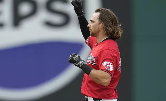 Cleveland Guardians' Daniel Schneemann gestures from second base after hitting a double in the third inning of a baseball game against the Chicago White Sox, Wednesday, July 3, 2024, in Cleveland. (AP Photo/Sue Ogrocki)
