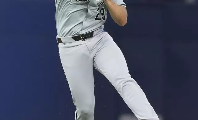 Chicago White Sox shortstop Paul DeJong throws to first base for an out during the second inning of a baseball game against the Miami Marlins, Saturday, July 6, 2024, in Miami. (AP Photo/Marta Lavandier)