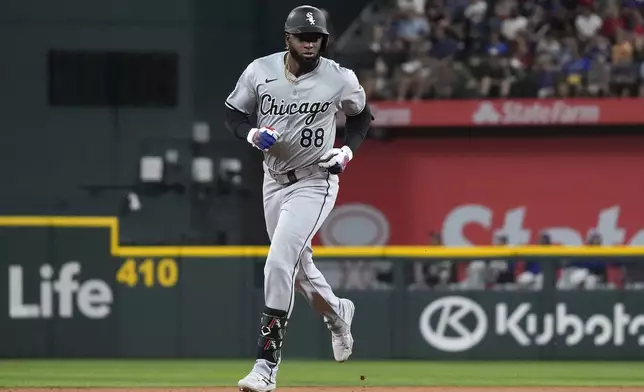 Chicago White Sox's Luis Robert Jr. runs the bases after hitting a home run during the third inning of a baseball game against the Texas Rangers in Arlington, Texas, Wednesday, July 24, 2024. (AP Photo/LM Otero)