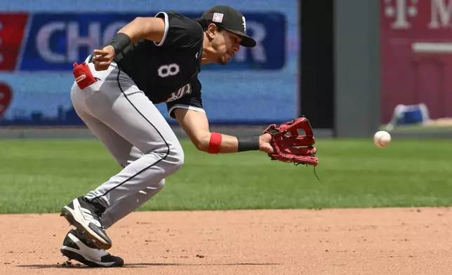 Chicago White Sox shortstop Nicky Lopez fields a ground ball off the bat of Kansas City Royals' Maikel Garcia for an out at first base during the fifth inning of a baseball game, Sunday, July 21, 2024, in Kansas City, Mo. (AP Photo/Reed Hoffmann)