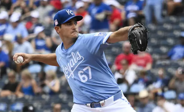 Kansas City Royals starting pitcher Seth Lugo throws to a Chicago White Sox batter during the first inning of a baseball game, Sunday, July 21, 2024, in Kansas City, Mo. (AP Photo/Reed Hoffmann)