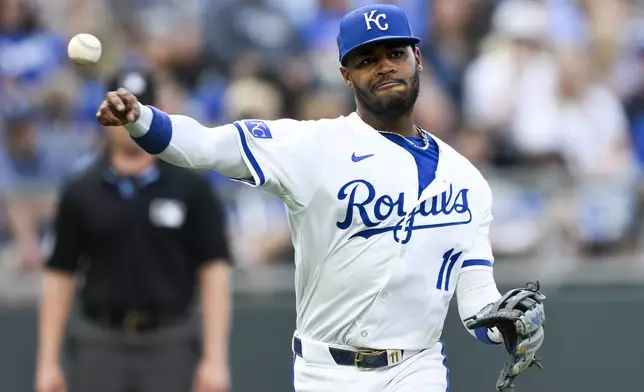 Kansas City Royals third baseman Maikel Garcia throws out Chicago White Sox' Nicky Lopez at first base during the third inning of a baseball game, Saturday, July 20, 2024, in Kansas City, Mo. (AP Photo/Reed Hoffmann)