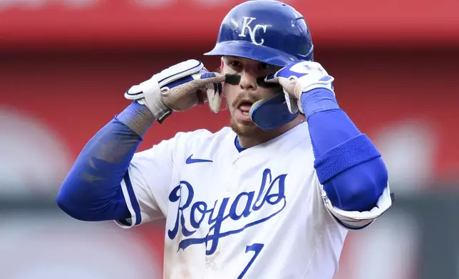 Kansas City Royals' Bobby Witt Jr. celebrates a one-RBI double against the Chicago White Sox during the second inning of a baseball game, Saturday, July 20, 2024, in Kansas City, Mo. (AP Photo/Reed Hoffmann)