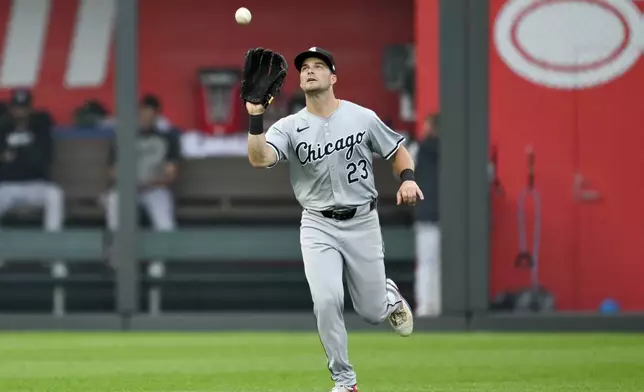 Kansas City Royals' Kyle Isbel flies out to Chicago White Sox left fielder Andrew Benintendi during the fourth inning of a baseball game, Saturday, July 20, 2024, in Kansas City, Mo. (AP Photo/Reed Hoffmann)