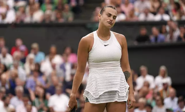 FILE - Aryna Sabalenka of Belarus reacts as she plays Tunisia's Ons Jabeur in a women's singles semifinal match on day eleven of the Wimbledon tennis championships in London, Thursday, July 13, 2023. Wimbledon favorite Aryna Sabalenka withdrew on Monday, July 1, 2024, because of an injured shoulder.(AP Photo/Alberto Pezzali, File)