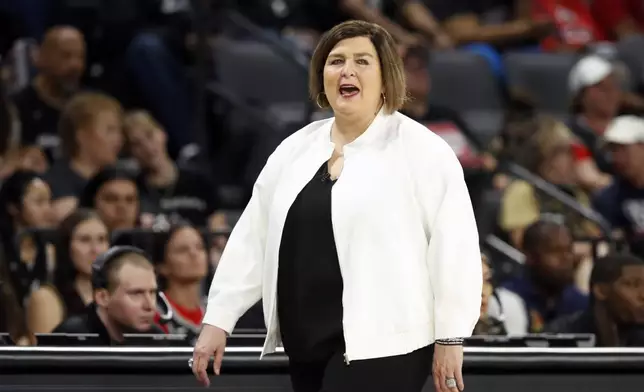 Dallas Wings head coach Latricia Trammell calls out to players during the first half of an WNBA basketball game against the Las Vegas Aces, Sunday, July 7, 2024, in Las Vegas. (Steve Marcus/Las Vegas Sun via AP)