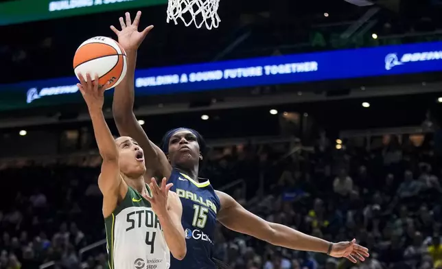 Seattle Storm guard Skylar Diggins-Smith (4) goes up to the basket against Dallas Wings center Teaira McCowan (15) during the first half of a WNBA basketball game, Monday, July 1, 2024, in Seattle. (AP Photo/Lindsey Wasson)