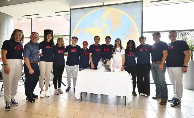 Utah's Olympic delegation poses for a photo at a sendoff celebration at the Salt Lake International Airport prior to boarding a flight to France on Monday, July 22, 2024. (Scott G Winterton/The Deseret News via AP)