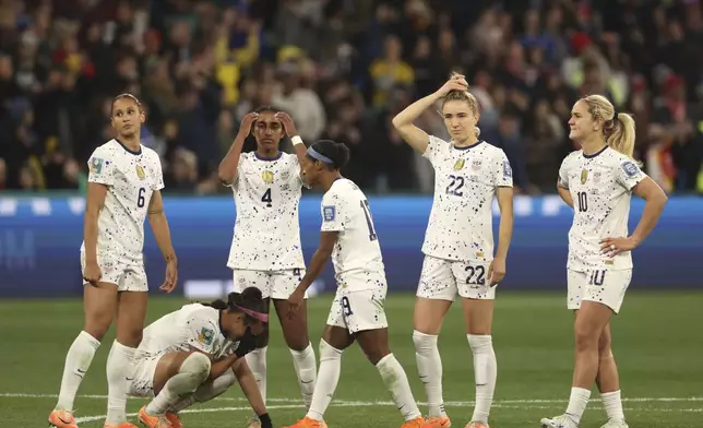 FILE - United States' players react after losing their Women's World Cup round of 16 soccer match against Sweden in a penalty shootout in Melbourne, Australia, Aug. 6, 2023. The U.S. women’s national team embarks on the 2024 Olympics in transition. The team’s slide from dominance on the world stage was evident by their early exit at last year’s Women’s World Cup. (AP Photo/Hamish Blair, File)