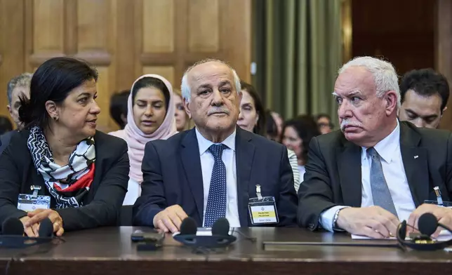 Palestinian foreign policy advisor Riad Malki and other members of the legal team take their seats before judges enter the International Court of Justice, or World Court, in The Hague, Netherlands, Friday July 19, 2024, where the United Nations top court is delivering a nonbinding advisory opinion Friday on the legality of Israel's 57-year occupation of lands sought for a Palestinian state, a ruling that could have more effect on international opinion than it will on Israeli policies. (AP Photo/Phil Nijhuis)