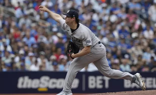 New York Yankees pitcher Gerrit Cole (45) throws during the first inning of a baseball game against the Toronto Blue Jays in Toronto, Sunday, June 30, 2024. (Frank Gunn/The Canadian Press via AP)