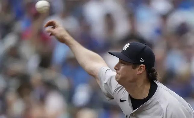 New York Yankees pitcher Gerrit Cole throws during second-inning baseball game action against the Toronto Blue Jays in Toronto, Sunday, June 30, 2024. (Frank Gunn/The Canadian Press via AP)